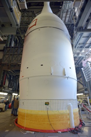 The Orion capsule, hidden under the protective shroud of the Launch Abort System, and with the simulated Service Module beneath it similarly hidden by cylindrical payload fairings, was mated to its Delta IV launch vehicle earlier in November