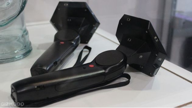 The Vive hand controllers (obviously prototype units), provide independent hand tracking via built-in sensors and allow virtual objects to be manipulated and handled by the user (image via Gizmo)