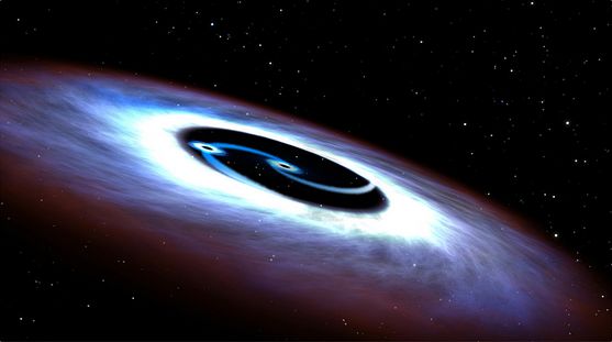 An artist's impression of the two black holes "powering" the quasar at the heart of galaxy Mrk 231 - image: NASA / ESA, via Astronomy Now
