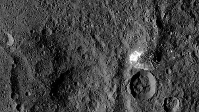 Ceres' strange, flat-topped mountain with brightly-streaked flanks - but not apparent debris left from any flow of material, and an oddly well-defined perimeter
