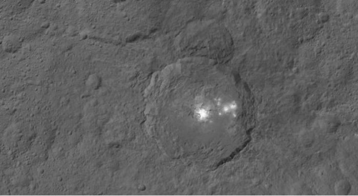 Occator crater and its brights spots images from directly overhead and a distance of 1,470 km (915 miles) by the Dawn space vehicle