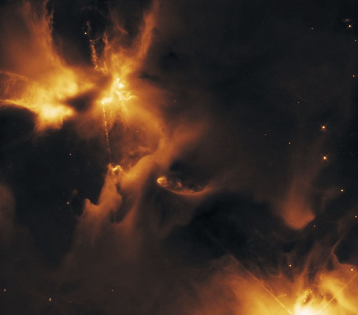 Another view of the "stellar nursery" where stars are being formed, captured by Hubble. HH24 can be seen at the top left, with further HH objects just visible in the lower right. Both this image and the one above were captured in infrared, allowing Hubble to "look through" the intervening clouds of dust and "see" the jets