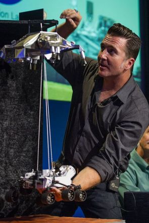 Adam Steltzner demonstrates the sky crane landing system at a press briefing ahead of MSL's arrival on the surface of Mars in August 2012