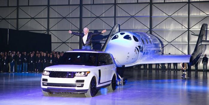 VSS Unity is rolled out in a ceremony which saw it christened by Professor Stephen Hawking and Sir Richard Branson's year-old granddaughter
