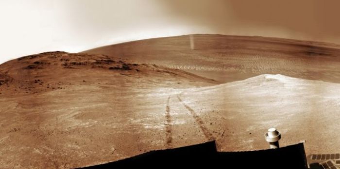 A mosaic of images by Opportunity showing a Martian dust devil (upper centre of the picture), skipping over the terrain behind the rover as it climbs Knudsen Ridge inside Marathon Valley on April 1st, 2016 (credit: NASA/JPL / Cornell / Ken Kremer kenkremer.com / Marco Di Lorenzo)