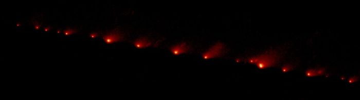 A Hubble Space Telescope image of comet Shoemaker-Levy 9, taken on May 17th, 1994, showing the train of fragments stretched across 1.1 million km (710,000 mi) of space, or 3 times the distance between Earth and the Moon