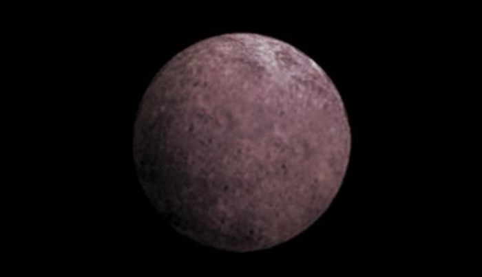 An artist's conception of 2007 OR10. Astronomers suspect that its rosy color is due to the presence of irradiated methane. Credit: NASA