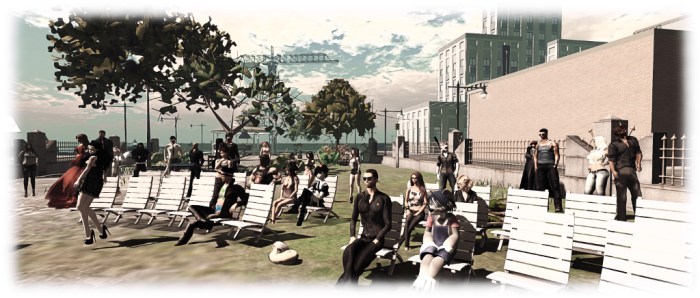 Xiola (to the front left) dances while Simon Linden (seated, front centre in his trademark top hat) listens, at the first round of the Music Fest auditions