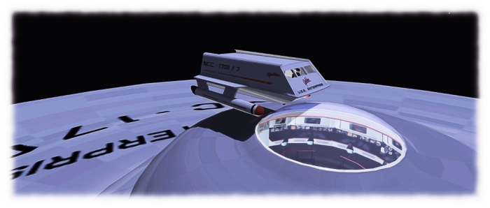 Hovering over the bridge: the shuttlecraft model sits seven, and Ctahy has left the sensor dome over the bridge trnasparent from the outside, so visitors can peek inside, a-la the original pilot episode