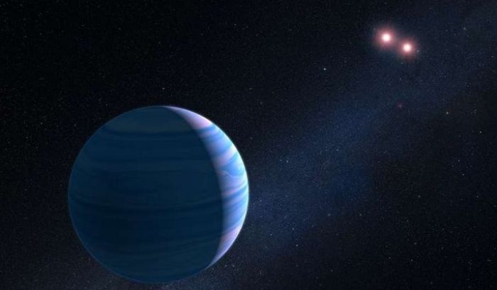 An artist's impression of the Saturn-like planet orbiting the red dwarf binary pair of OGLE-2007-BLG-349. The two tiny stars are just 11.2 million km apart, and the planet orbits them at a distance og 480 million km. It is the first time the Hubble Space Telescope has used gravitational microlensing to confirm an exoplanet. Credit: G. Bacon (STScI).