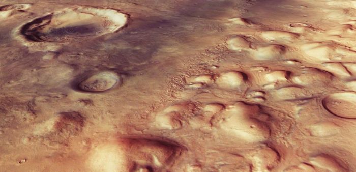 A high resolution image of Colles Nili from a slightly different perspective reveals the rounded hills, together with the faint ridges and troughs, many of which cut through impact craters, suggesting the passage of glaciers over several million years