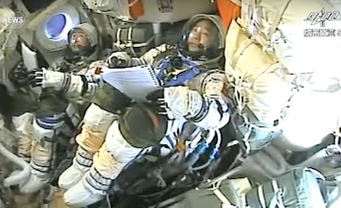 Jing Haipeng (foreground) and Chen Dong aboard the Shenzhou 11 vehicle prior to re-entry into Earth's atmosphere, Friday, November 18th