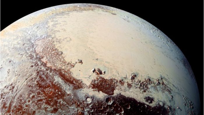 "Sputnik Planum" (the left lobe of Pluto's "heart") is believed to be a "positive mass anomaly" which has contributed to the planet's axial tilt, and to the planet's developing weather systems and look, to the point where today, the weather is as much accountable for the planet's looks and position in space and any other factor influencing it. Credit: James Keane