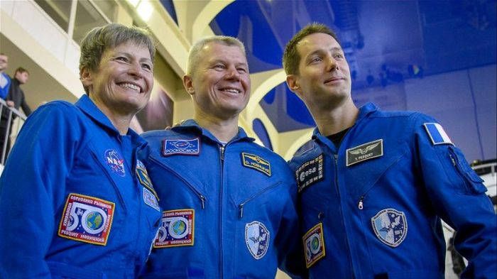 Peggy Witson with Oleg Novitsky and Thomas Pesquet posing for photographs prior to launch. Via: Peggy Whitson