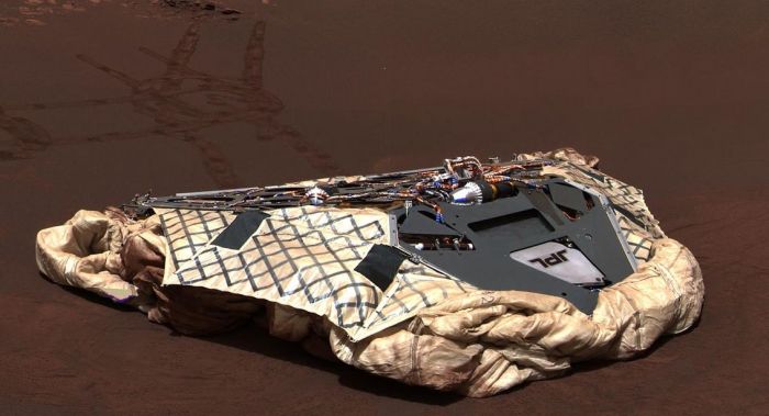 Opportunity's lander, with the airbags used to protect vehicle and lander as they bounced across Mars on their arrival, deflated and retracted beneath it. The lander was renamed Challenger Memorial Station on the occasion of the 18th anniversary of the Challenger disaster. Credit: NASA