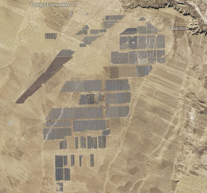 The Longyangxia solar farm, China. In 2016, China installed the equivalent of one and a half soccer fields of solar panels every hour. Credit: NASA / Landsat