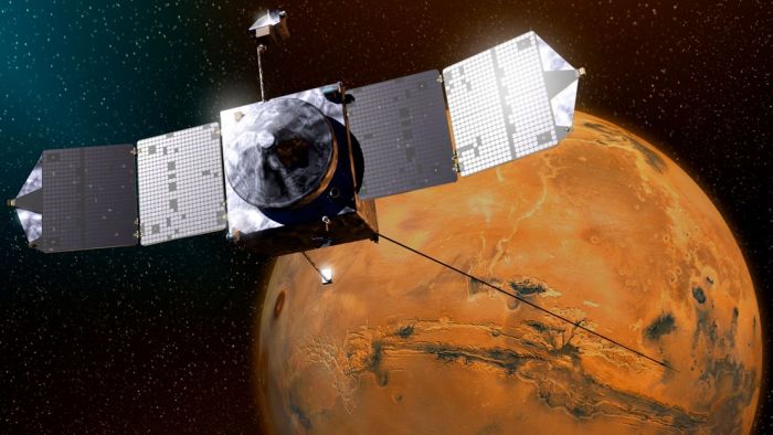 An artist's impression of MAVEN as it looks down on Mars' Vallis Marineris. The NASA mission, which arrived in orbit in September 2014, is studying the Martian atmosphere